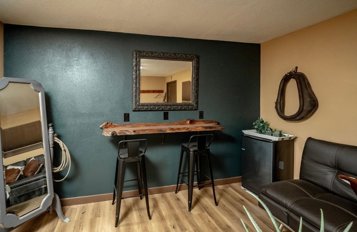 Rustic lounge room with live-edge bar and leather seating